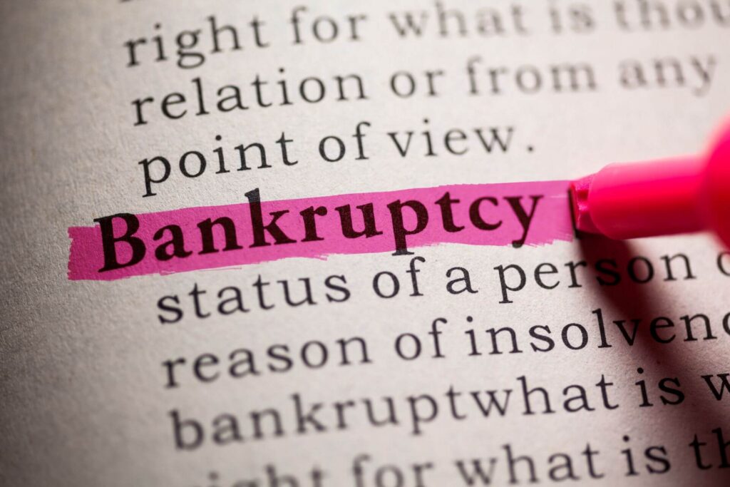Dictionary defines bankruptcy with pink highlight